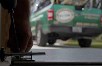 Technician Repairing Garage Door